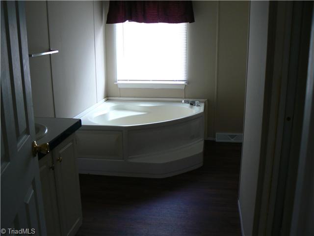4987 King View Road Asheboro, NC 27205 - Photo 11 of 16 Master Bath/Spa. The Master Bedroom is 13 x14 3". The Master Bath is 8 8" x 13 and has garden tub and separate shower.