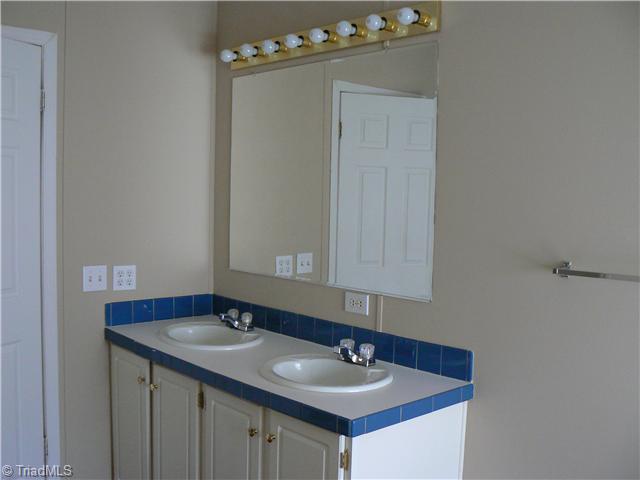 4987 King View Road Asheboro, NC 27205 - Photo 12 of 16 Master Bath/Spa. The Master Bath also has two sinks. Notice how clean this home is.