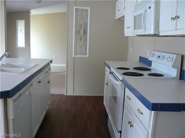 Kitchen. Looking back toward the front entry from the kitchen.  There is plenty of natural light in this kitchen.