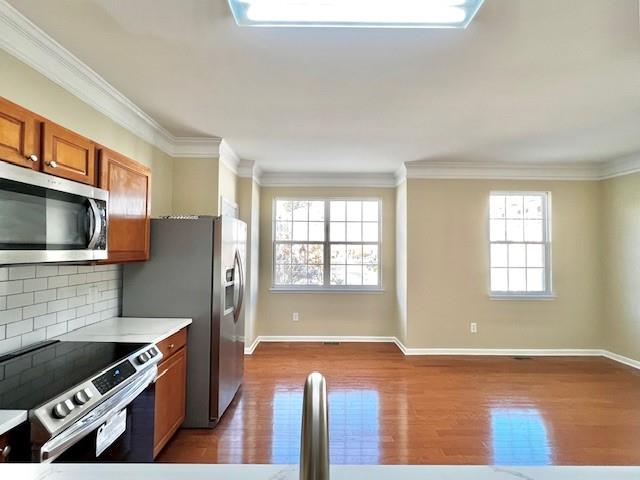 2459 Ivey Crest Circle Tucker, GA 30084 - Photo 7 of 18 a kitchen with stainless steel appliances granite countertop a stove a sink and a microwave