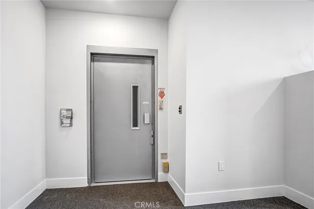 a view of parking garage with cars