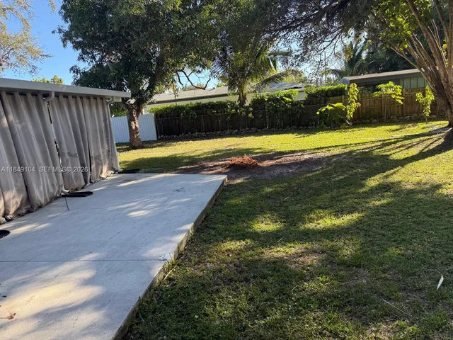 an aerial view of a house with a garden