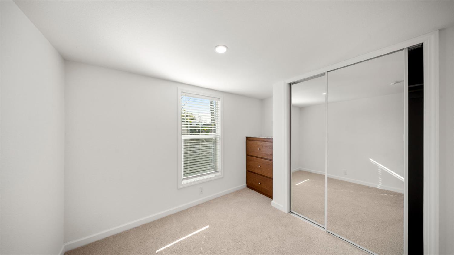 2784 Monterey Road, Unit 43A San Jose, CA 95111 - Photo 6 of 13 an empty room with furniture and a window