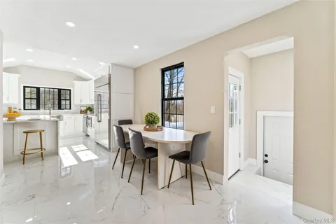 a kitchen that has a lot of cabinets in it and appliances