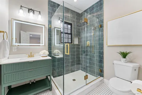 a bedroom with a bed next to a window