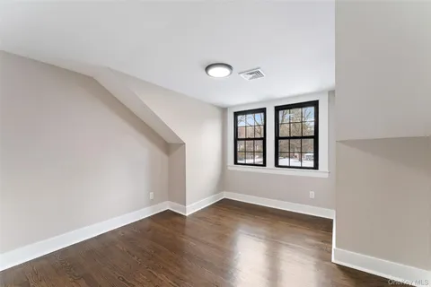 a dining room with furniture and a window