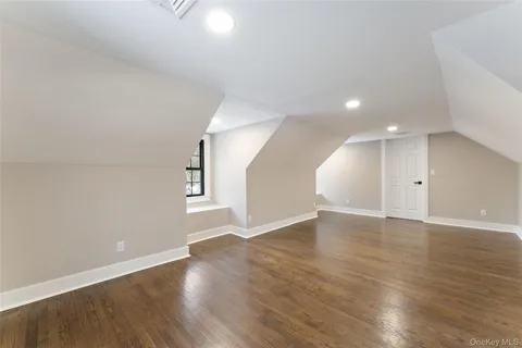 a view of a yard with snow on the road