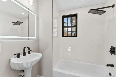 a kitchen with stainless steel appliances granite countertop a sink refrigerator and cabinets