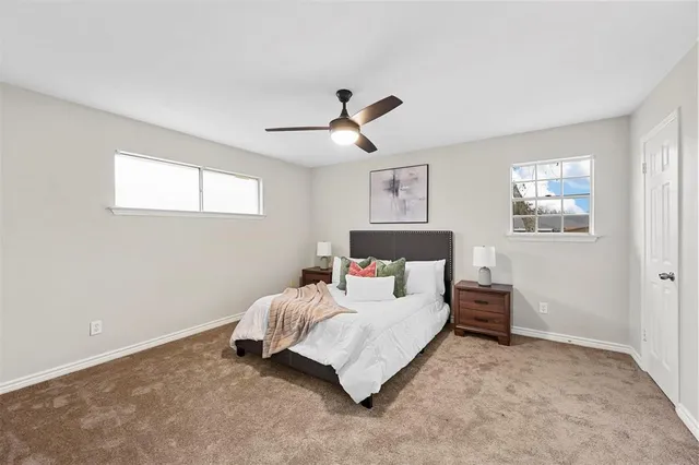 a bedroom with bed and window