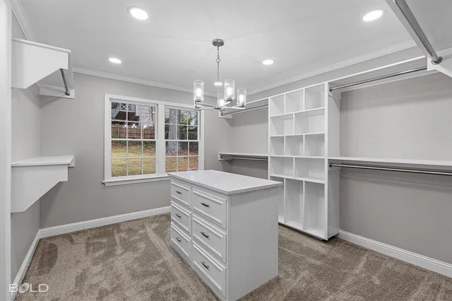 an empty room with windows and ceiling fan