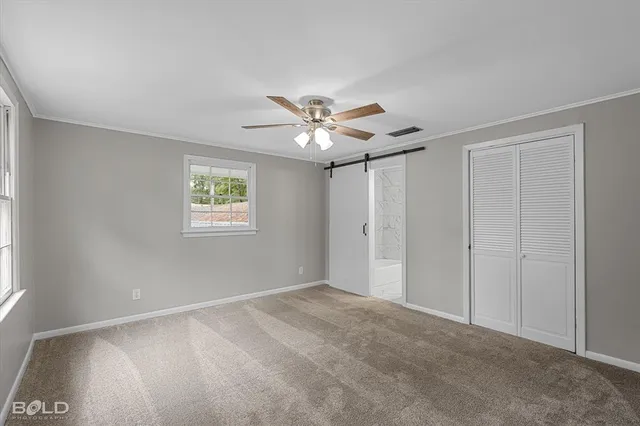 a spacious bathroom with a granite countertop sink and a mirror
