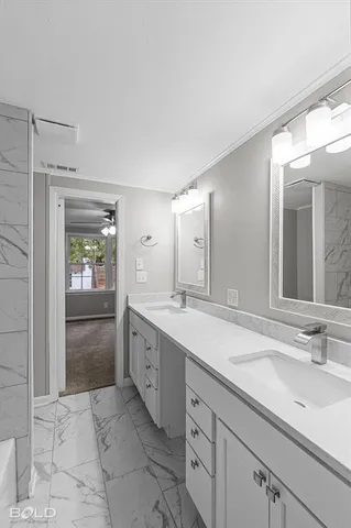 a bathroom with a bathtub and a shower