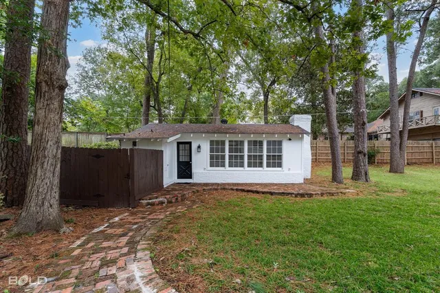 wooden floor in an empty room with a fireplace