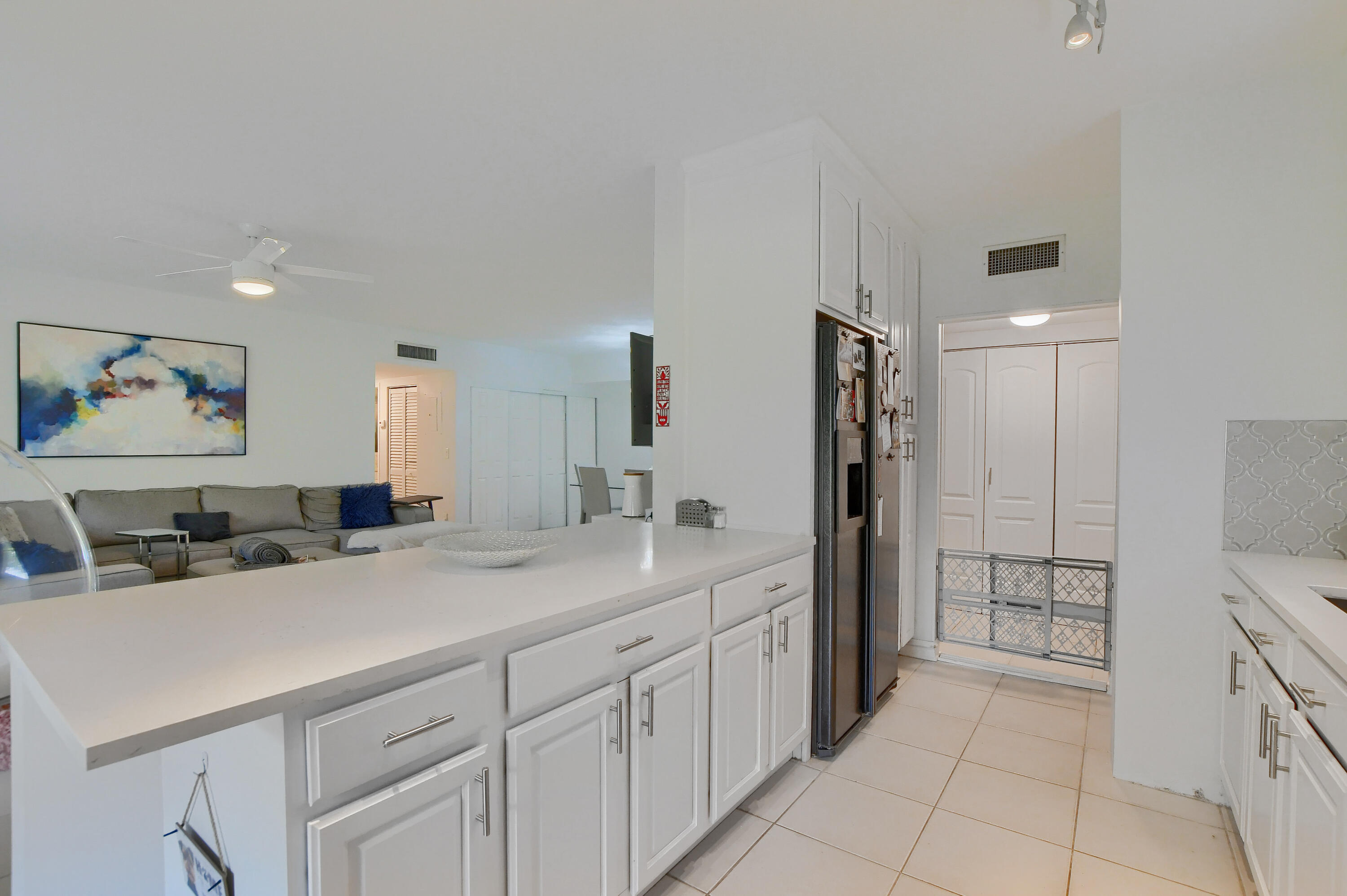 6314 Longboat Lane West, Unit 102 Boca Raton, FL 33433 - Photo 11 of 24 kitchen open to living room