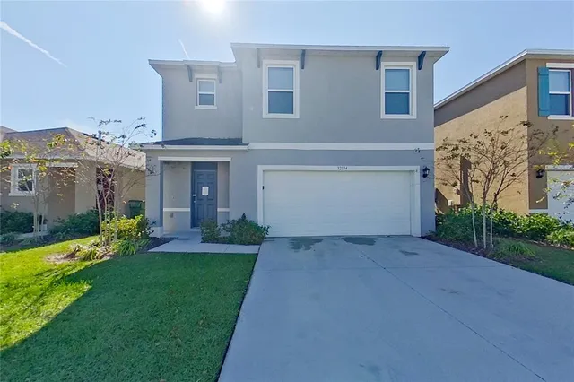 front view of a house with a yard