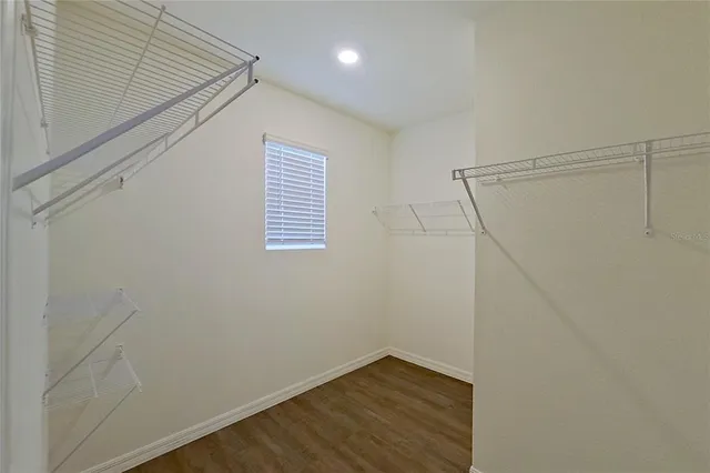 a view of a room with wooden floor and staircase
