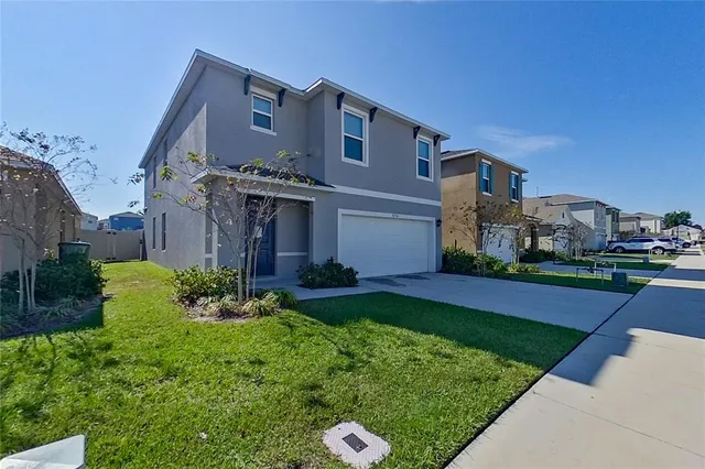 a front view of a house with a yard