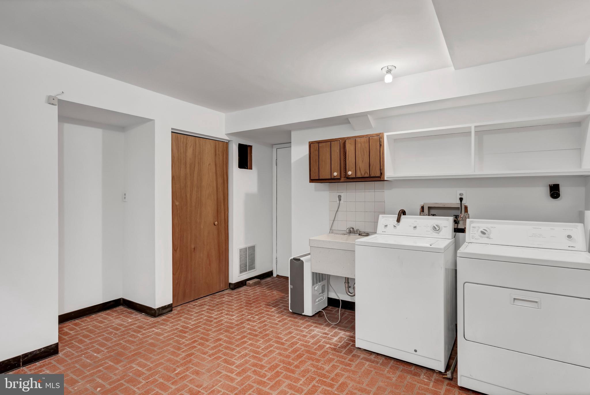 12211 Brookhaven Drive Silver Spring, MD 20902 - Photo 41 of 54 Mudroom / Laundry with Ample Storage Space