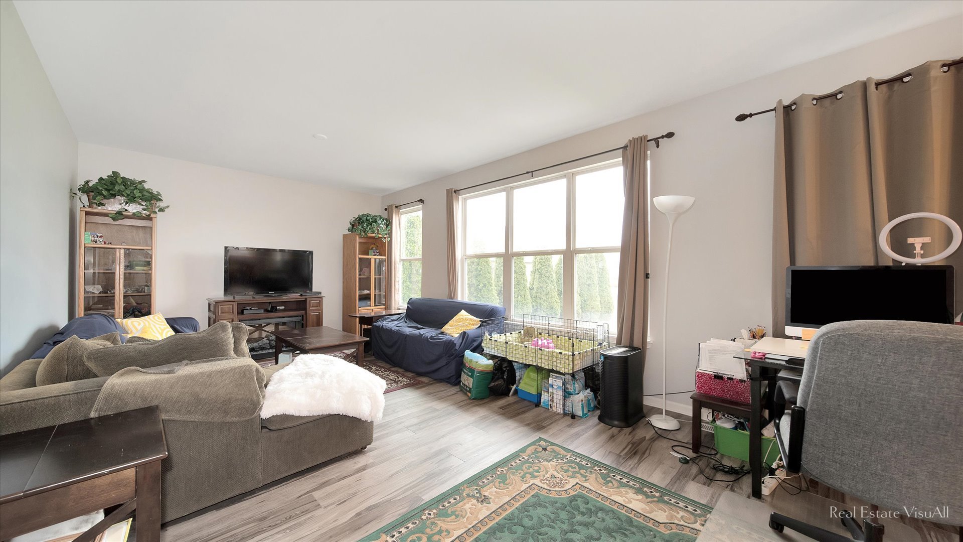 846 Oak Ridge Boulevard Elgin, IL 60120 - Photo 8 of 19 a living room with furniture a flat screen tv and a large window