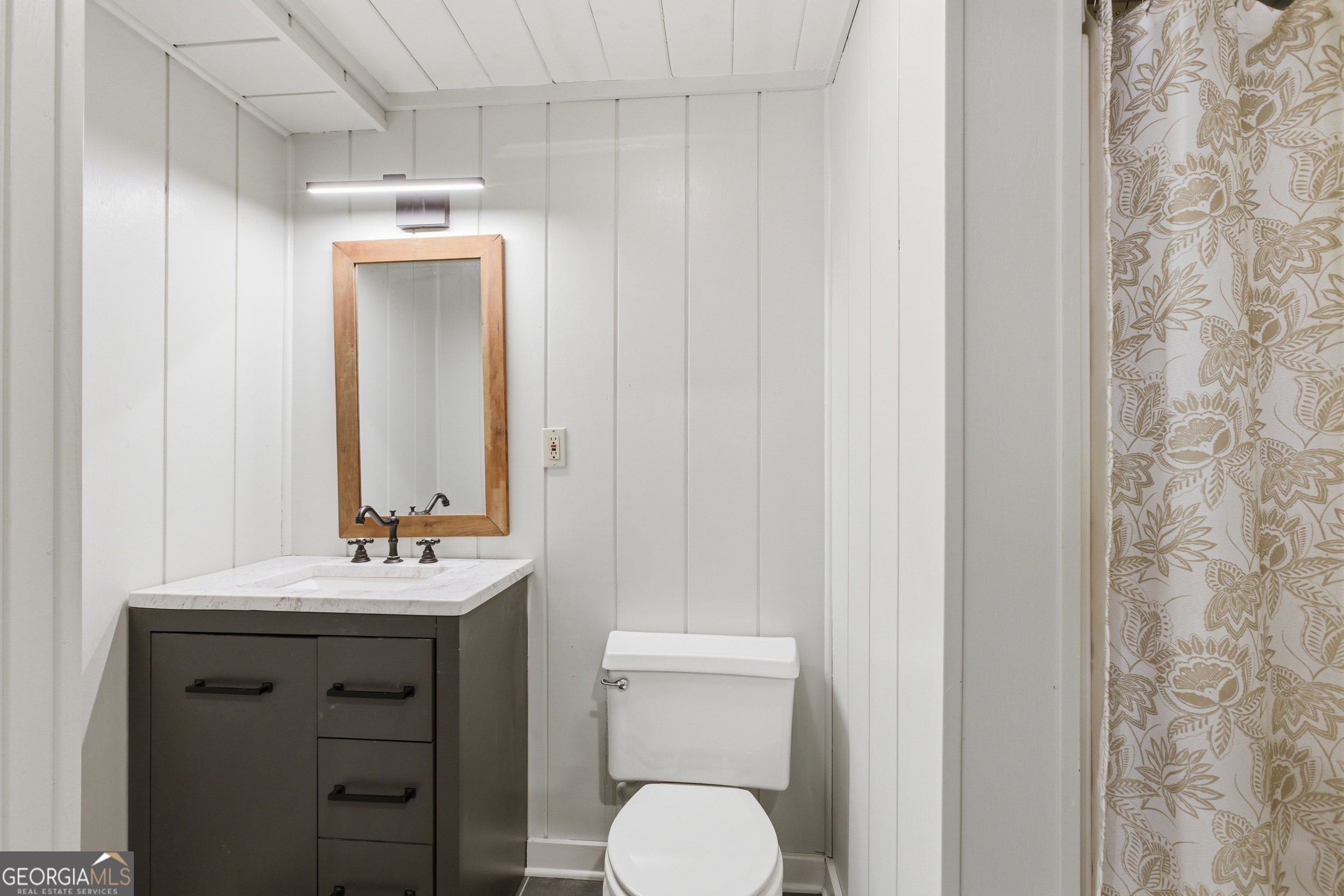 1921 Franklin Road Highlands, NC 28741 - Photo 35 of 72 a bathroom with a sink vanity and a mirror