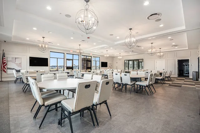 a kitchen with a table and chairs in it