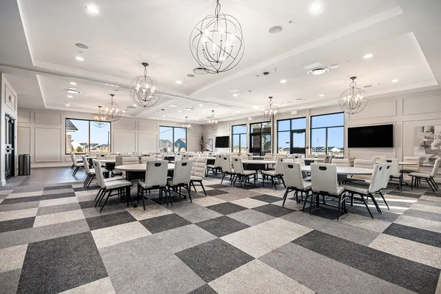 a view of a livingroom with furniture and a flat screen tv
