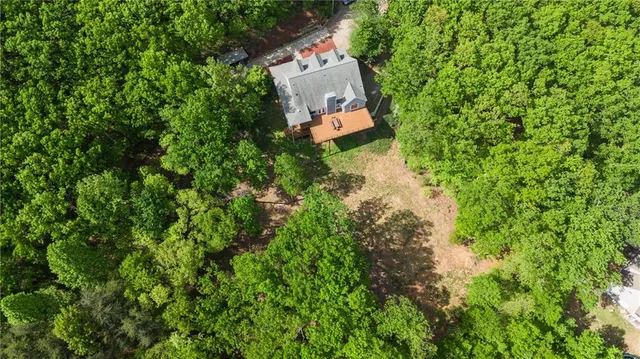 a kitchen with counter top space and wooden floor