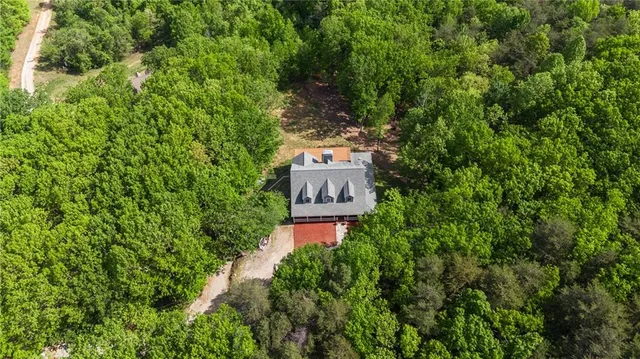 a view of a balcony with floor to ceiling windows with wooden floor