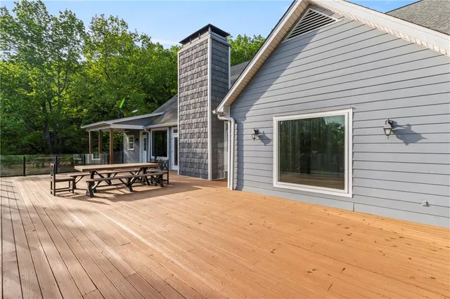 a bedroom with a large bed and a large window