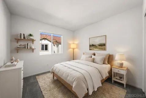 a bedroom with a bed and a couch