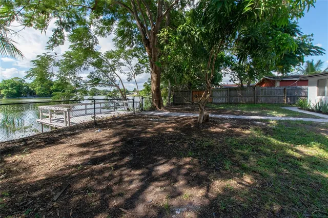 a view of a backyard with green space