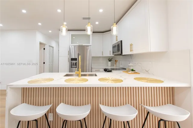 a bathroom with a sink a mirror and a toilet