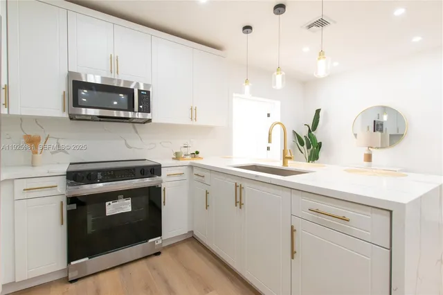 a kitchen with a stove and a sink
