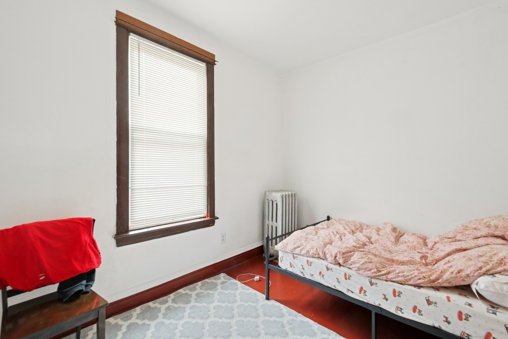 2627 West Rice Street Chicago, IL 60622 - Photo 11 of 14 a bedroom with a bed and a window