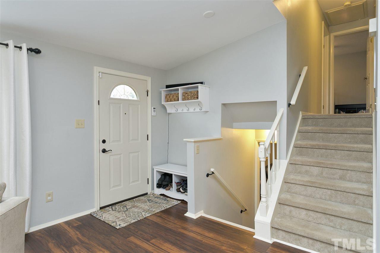 408 Electra Drive Cary, NC 27513 - Photo 11 of 25 a view of entryway with wooden floor and stairs