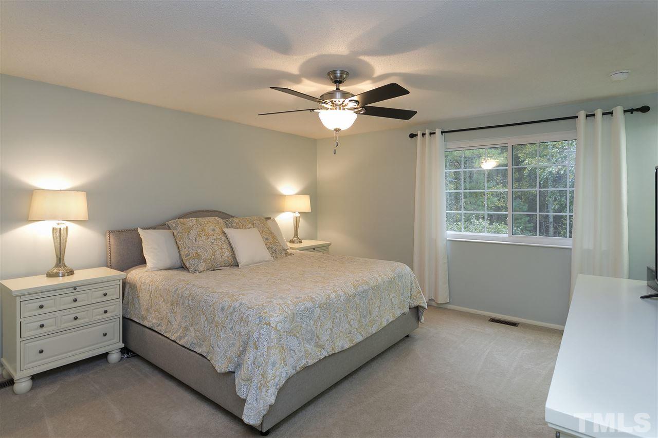 408 Electra Drive Cary, NC 27513 - Photo 12 of 25 a bedroom with a bed and a window
