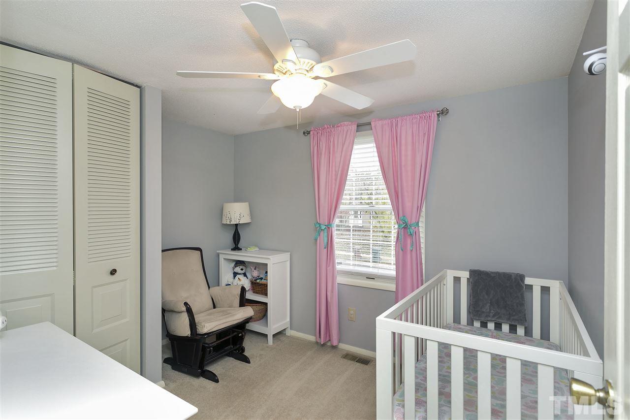 408 Electra Drive Cary, NC 27513 - Photo 15 of 25 a bedroom with a bed and a window