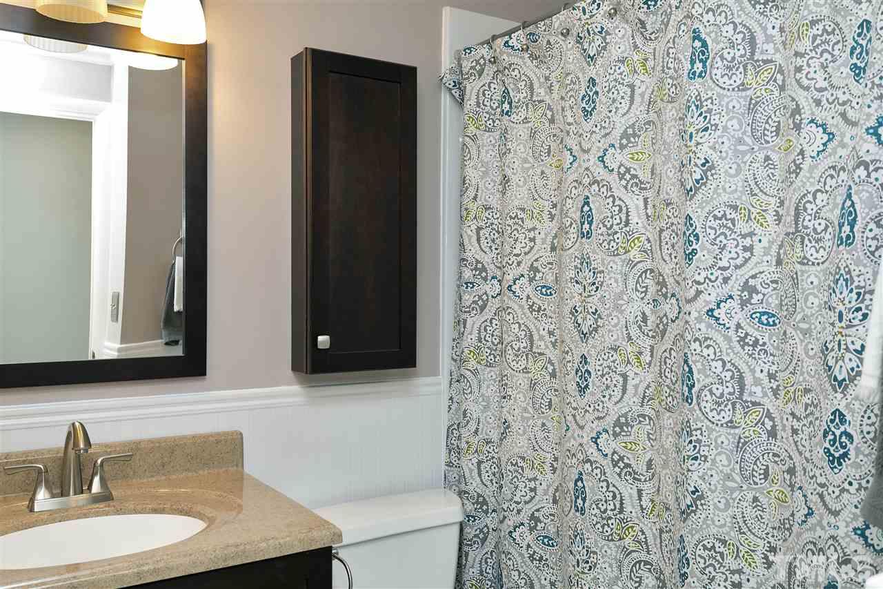 408 Electra Drive Cary, NC 27513 - Photo 16 of 25 a bathroom with a sink and a mirror