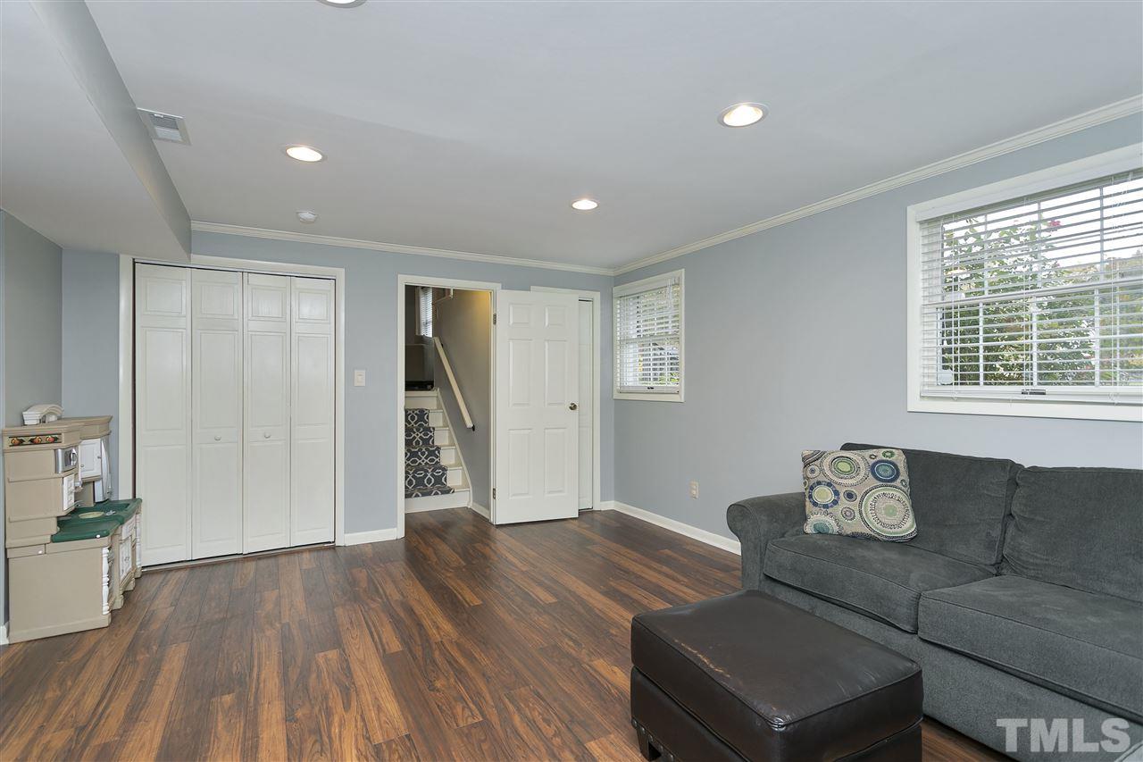 408 Electra Drive Cary, NC 27513 - Photo 18 of 25 a living room with furniture and wooden floor