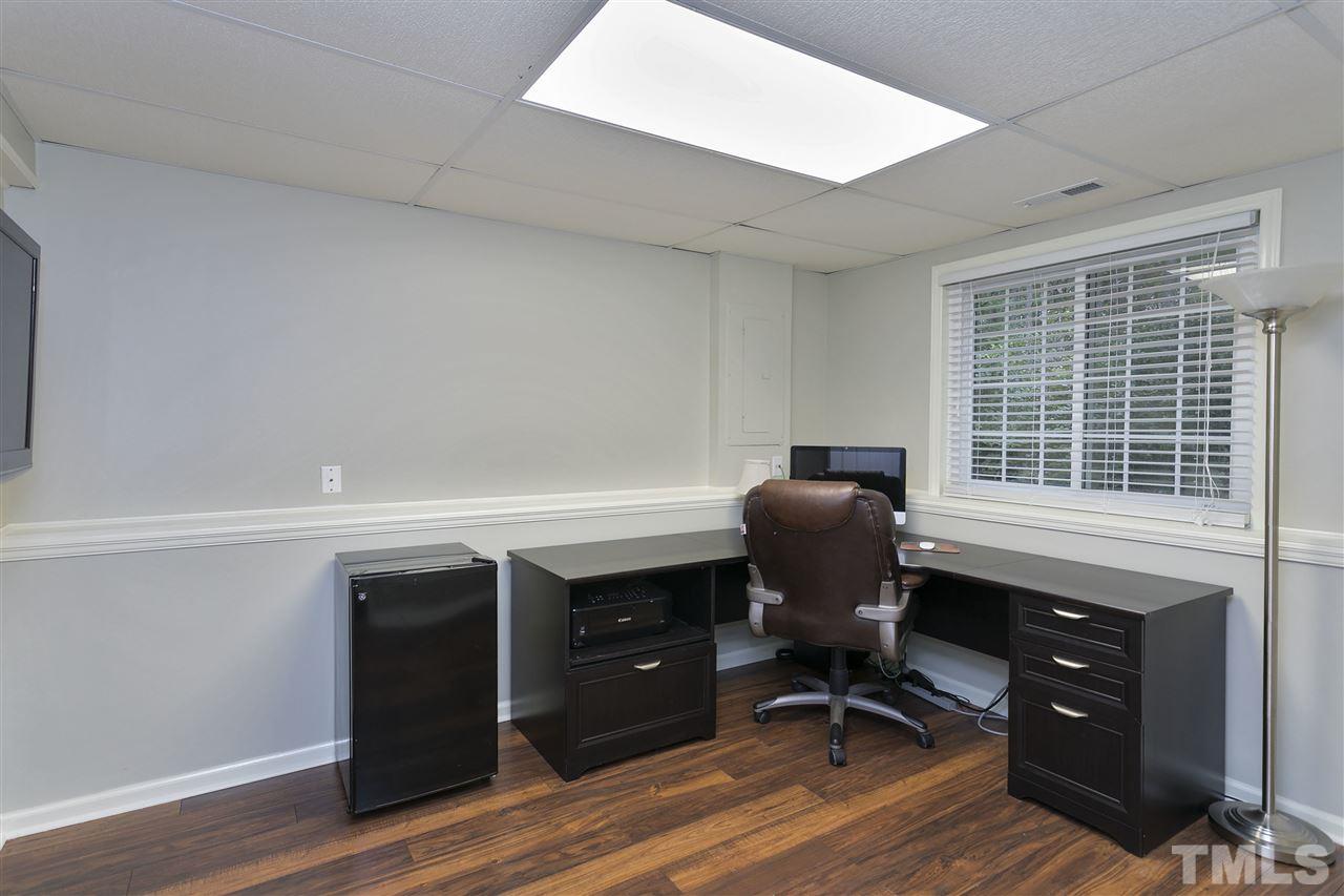 408 Electra Drive Cary, NC 27513 - Photo 19 of 25 a view of a workspace with furniture and a window