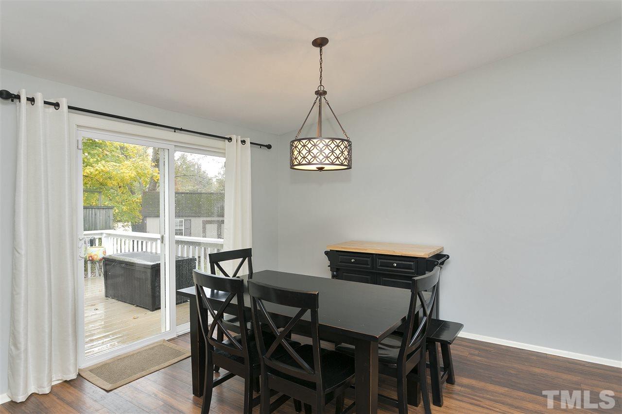 408 Electra Drive Cary, NC 27513 - Photo 9 of 25 a view of a dining room with furniture window and outside view