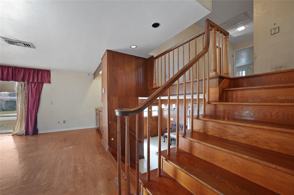 612 West Whidden Street Arcadia, FL 34266 - Photo 18 of 58 a view of staircase with wooden floor and stairs