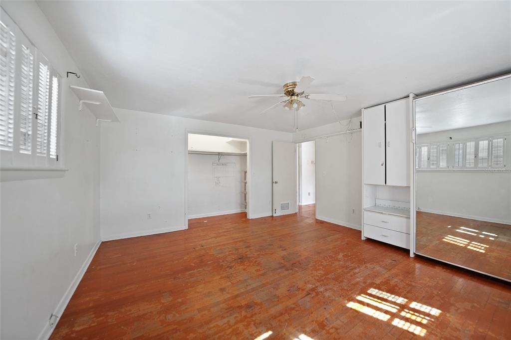 612 West Whidden Street Arcadia, FL 34266 - Photo 22 of 58 a view of empty room with wooden floor and fan