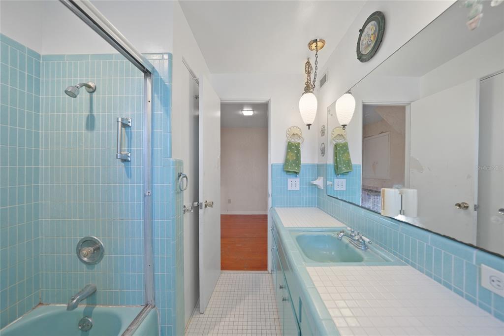 612 West Whidden Street Arcadia, FL 34266 - Photo 24 of 58 a bathroom with a granite countertop sink a mirror a vanity and shower