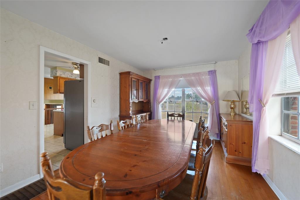 612 West Whidden Street Arcadia, FL 34266 - Photo 8 of 58 a dining room with furniture window and wooden floor