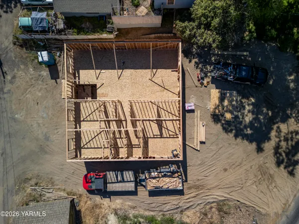 a view of a street with potted plants