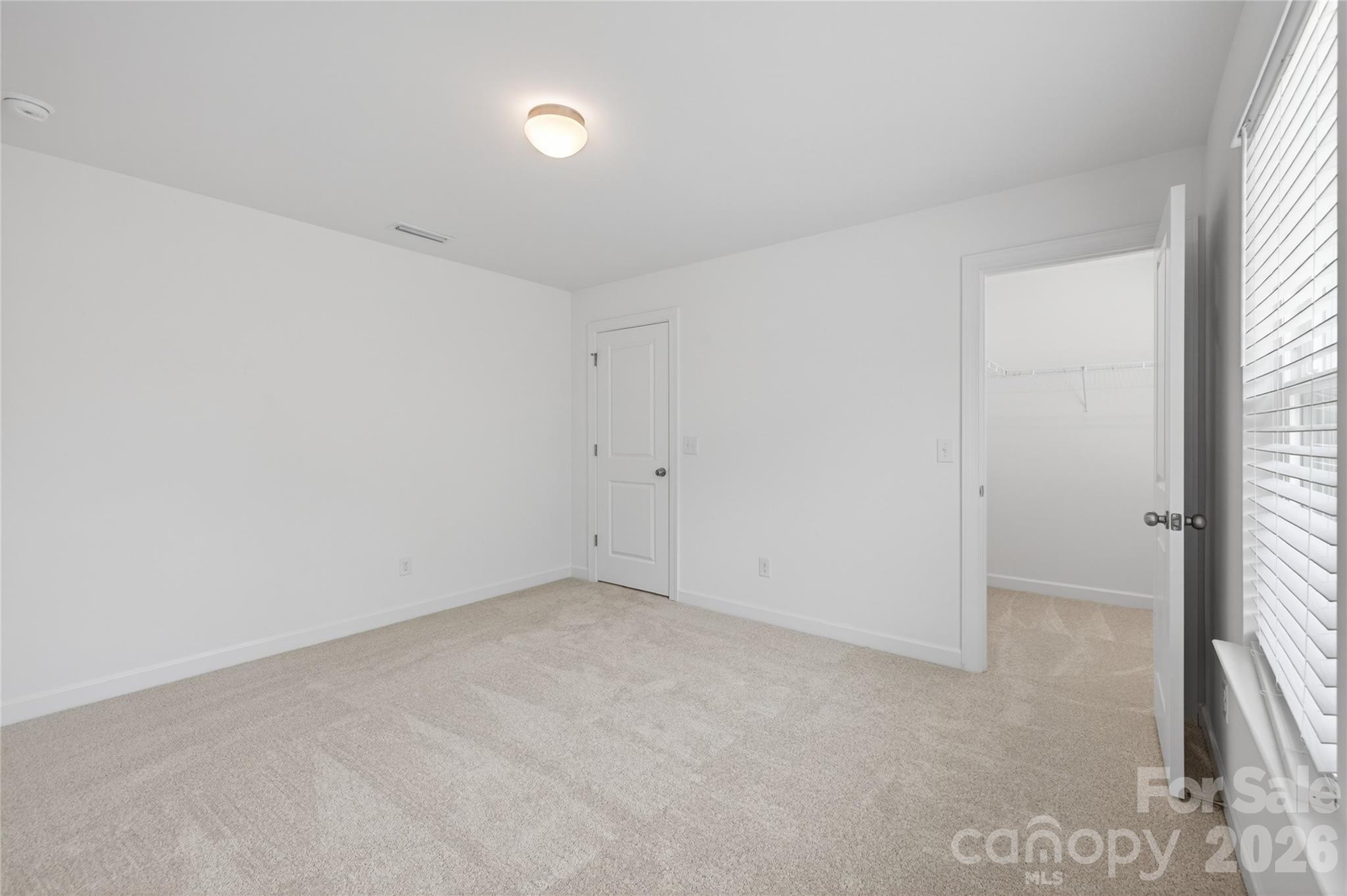 128 Overcash Road, Unit 7171 Troutman, NC 28166 - Photo 28 of 41 an empty room with windows