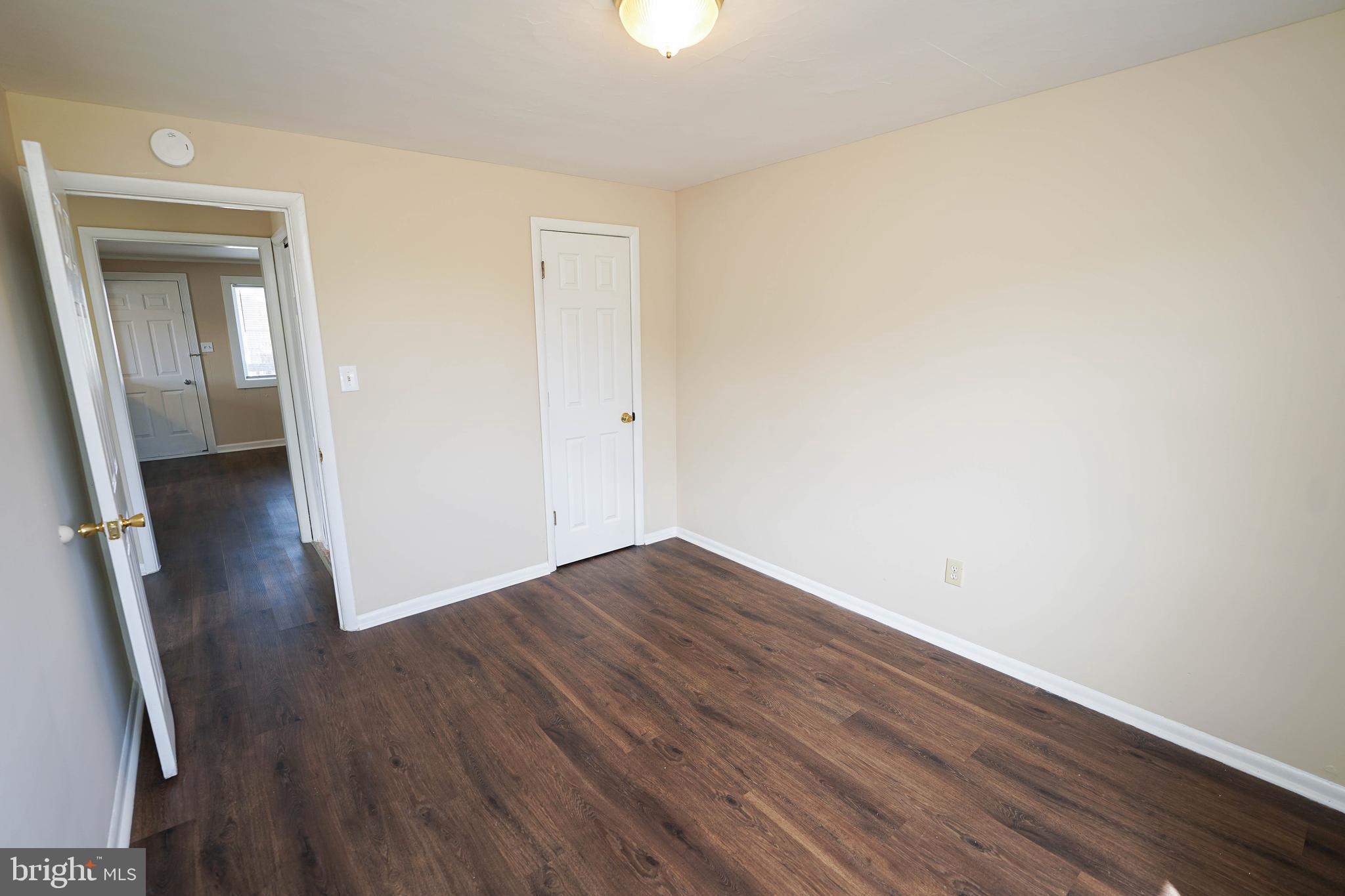 516 Bay Street, Unit D4 Berlin, MD 21811 - Photo 18 of 27 a view of a room with wooden floor