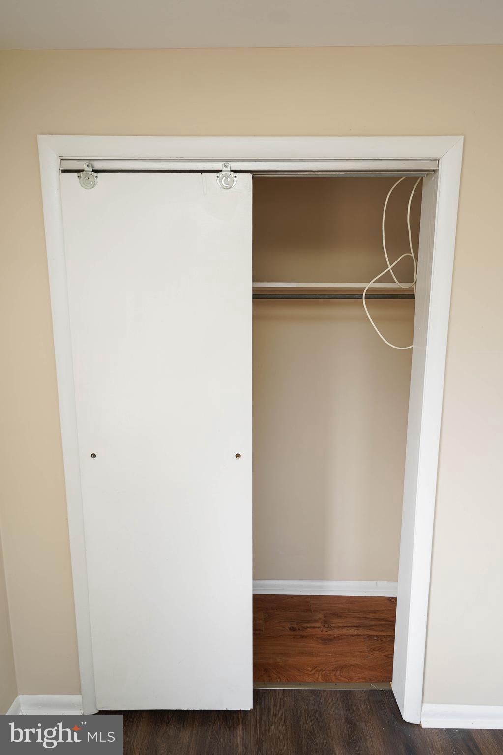 516 Bay Street, Unit D4 Berlin, MD 21811 - Photo 27 of 27 a view of walk in closet with clothes