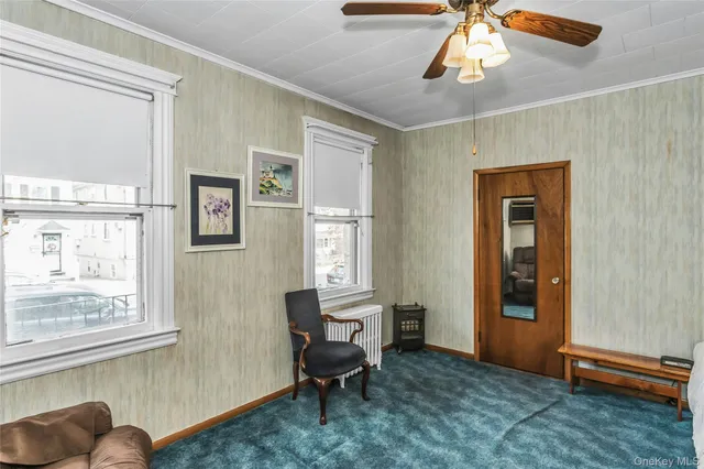 a living room with furniture and a window